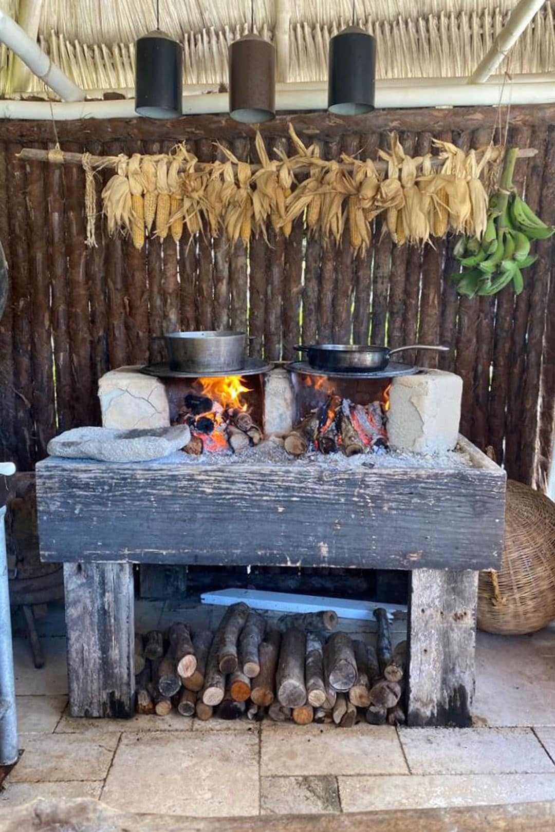 Food being cooked on a traditional Belizean fire hearth